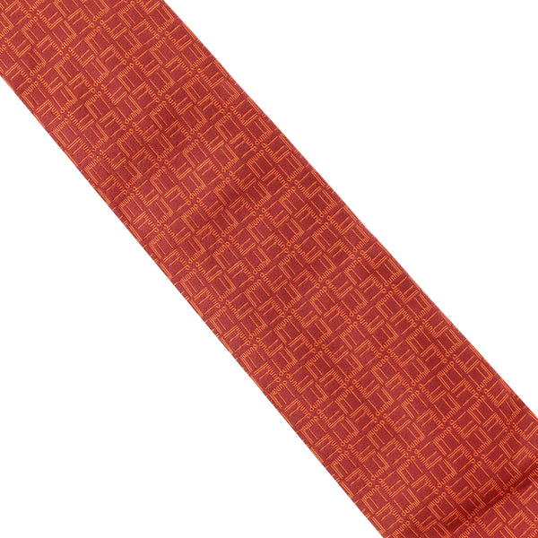 Dunhill silk tie in a geometric longtail pattern copper orange