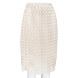 A Christopher Kane pencil skirt which is intricately shaped to appear woven