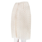 A Christopher Kane pencil skirt which is intricately shaped to appear woven