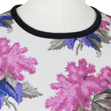 A short dress in a floral pattern by Caterina Gatta