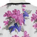 A short dress in a floral pattern by Caterina Gatta