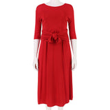 An elegant midi dress in pillar box red by Giambattista Valli