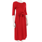 An elegant midi dress in pillar box red by Giambattista Valli