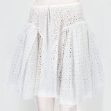 Alaia skater skirt in a sheer macrame soleil pattern white