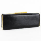 Vintage Gucci purse finished in black lizard leather