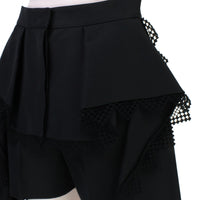 Alexander McQueen black lace trimmed shorts with draped side