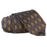 Dries Van Noten Art Deco Patterned Tie  Colour: Copper, bronze and midnight blue Made in Italy Material: 100% silk Blade width: 7.5 cm  Dries Van Noten tie in an Art Deco inspired jacquard silk Monochrome Art Deco pattern to back in ink blue with contrasting stripe