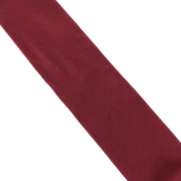 Dunhill tie woven in silk and features a subtle pattern inspired by the textural detailing found on dunhill Rollagas lighters burgundy
