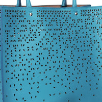 Alaia tote bag in a blue lagoon tone leather