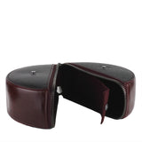 Burgundy Assemblage circular leather clutch in black and burgundy