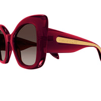 Alexander McQueen sunglasses in an oversize ruby red frame