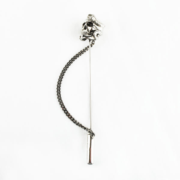 Alexander McQueen lapel pin with skull and snake detailing