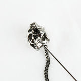 Alexander McQueen lapel pin with skull and snake detailing