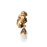 Alexander McQueen jewelled ear cuff in a signature antiqued gold tone
