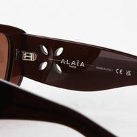 Alaia sunglasses in a dark toffee brown frame