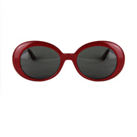 Saint Laurent Surf oval sunglasses in a cherry red tone