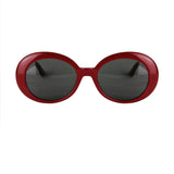 Saint Laurent Surf oval sunglasses in a cherry red tone