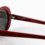 Saint Laurent Surf oval sunglasses in a cherry red tone