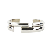 Alexander McQueen metal cuff in a mirrored silver tone finish