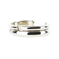 Alexander McQueen metal cuff in a mirrored silver tone finish