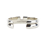 Alexander McQueen metal cuff in a mirrored silver tone finish