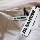 Jil Sander collarless cocoon coat in a luxurious pastel pink wool fabric