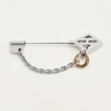Hermes Cle H brooch&nbsp;<br><span data-mce-fragment="1">Crafted in horn and metal with palladium-plated hardware</span>