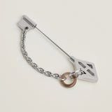 Hermes Cle H brooch&nbsp;<br><span data-mce-fragment="1">Crafted in horn and metal with palladium-plated hardware</span>