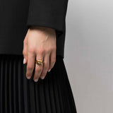 Alexander McQueen hinged double signet ring in a gold tone finish