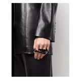 Alexander McQueen triple finger gaze ring in black