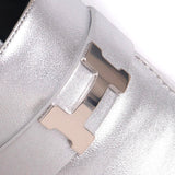 Hermes Trocadero mules in a metallic silver grained leather