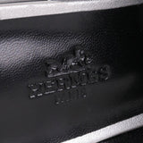 Hermes Trocadero mules in a metallic silver grained leather