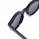 Cutler & Gross 1390 round sunglasses in black on blue