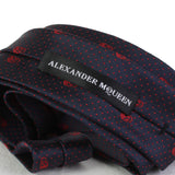 Alexander McQueen tie in a midnight blue and claret red skull and dot pattern silk