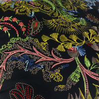 Luxurious cushion in Tumulte Arlequin fabric by Christian Lacroix Maison