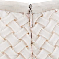 A Christopher Kane pencil skirt which is intricately shaped to appear woven