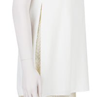 An Adam Lippes dress in layered white crepe and pale gold tone lace