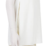 An Adam Lippes dress in layered white crepe and pale gold tone lace