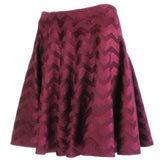 Alaia circular skater skirt in claret velvet with chevron patterning