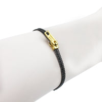 Tom Binns zip inspired bracelet in a gunmetal tone and gold