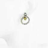 Tom Binns crystal hoop earrings with gold tone skull pendant detailing