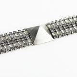 Tom Binns bracelet in an antique tone silver with pyramid and crystal detailing