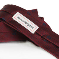 Alexander McQueen narrow silk tie in claret red and navy blue skull and dot pattern