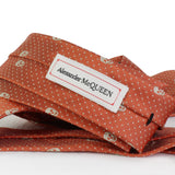 Alexander McQueen silk tie in apricot and ivory with signature skull and dot pattern
