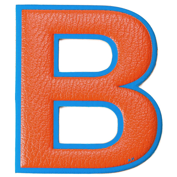 Anya Hindmarch Stickershop Oversized B Letter sticker in a clementine orange grained leather